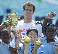 Andy Murray celebrating with local kids after his WImbledon triumph. (Image available on digitalspy.co.uk)